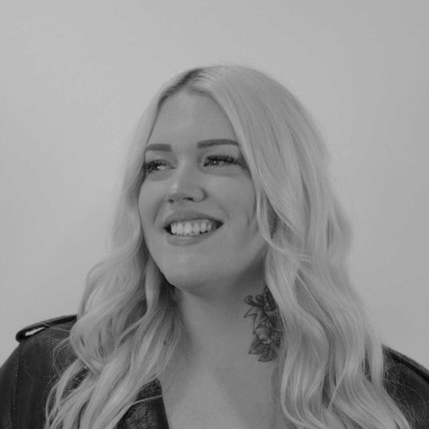 Portrait of Monique, a professional stylist at CONFETTI CROWN. a salon+spa, showcasing their expertise and style.