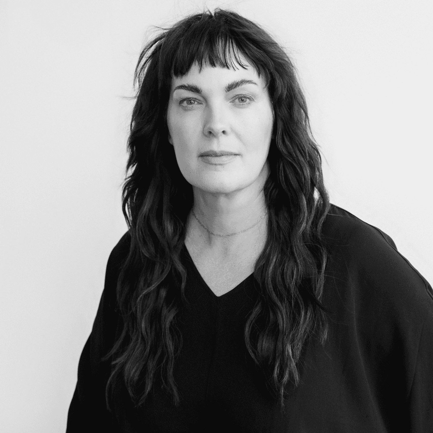 Portrait of Tiffiny, a professional stylist at CONFETTI CROWN. a salon+spa, showcasing their expertise and style.