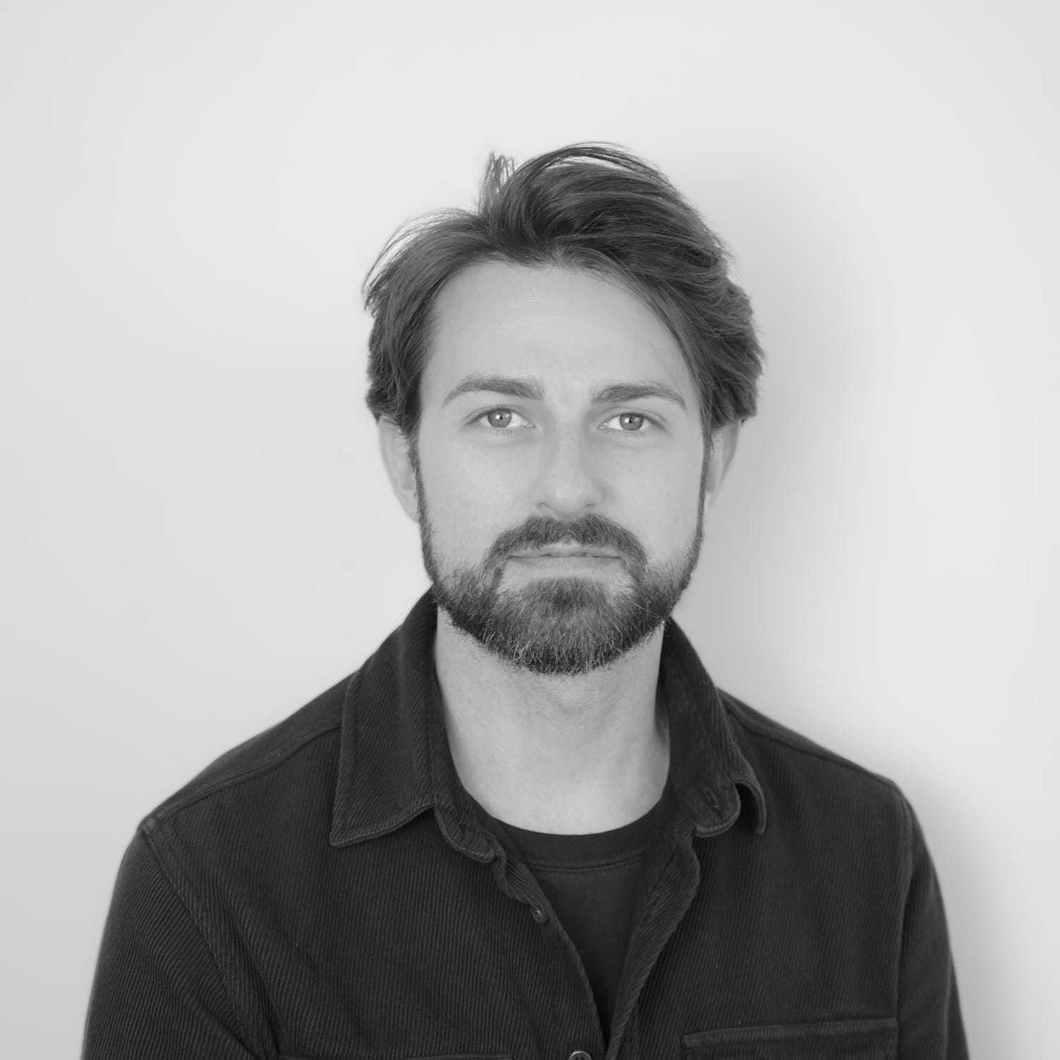 Portrait of Sam, a professional stylist at CONFETTI CROWN. a salon+spa, showcasing their expertise and style.