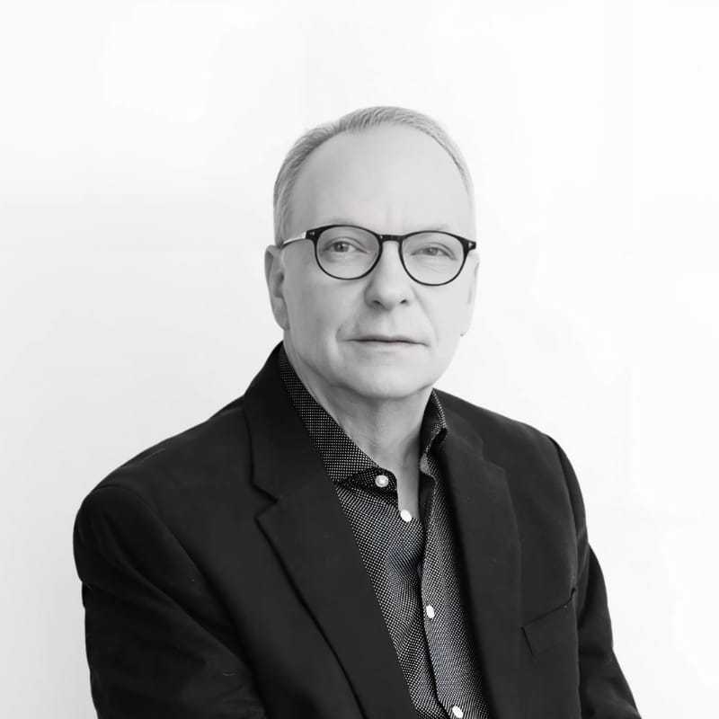 Portrait of Frank, a professional stylist at CONFETTI CROWN. a salon+spa, showcasing their expertise and style.