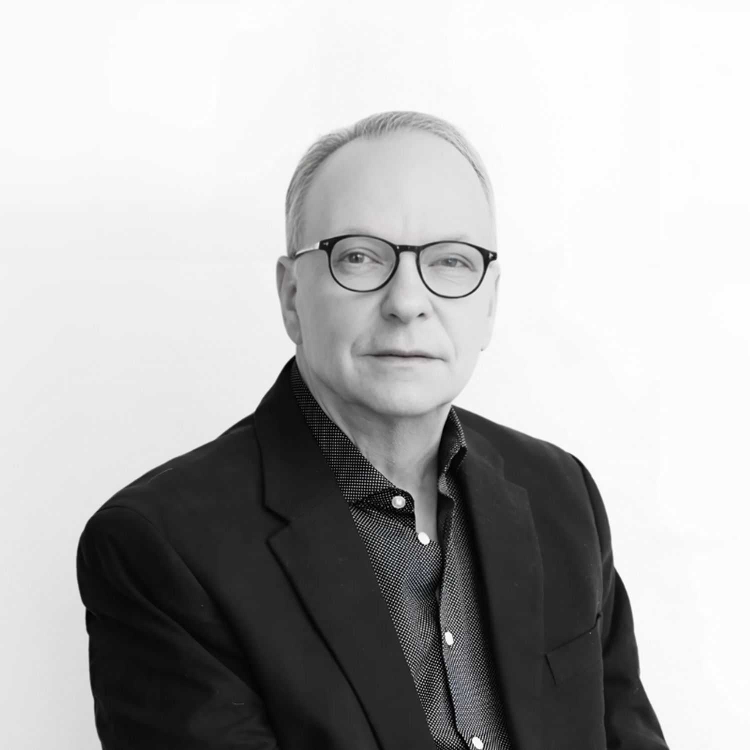 Portrait of Frank, a professional stylist at CONFETTI CROWN. a salon+spa, showcasing their expertise and style.