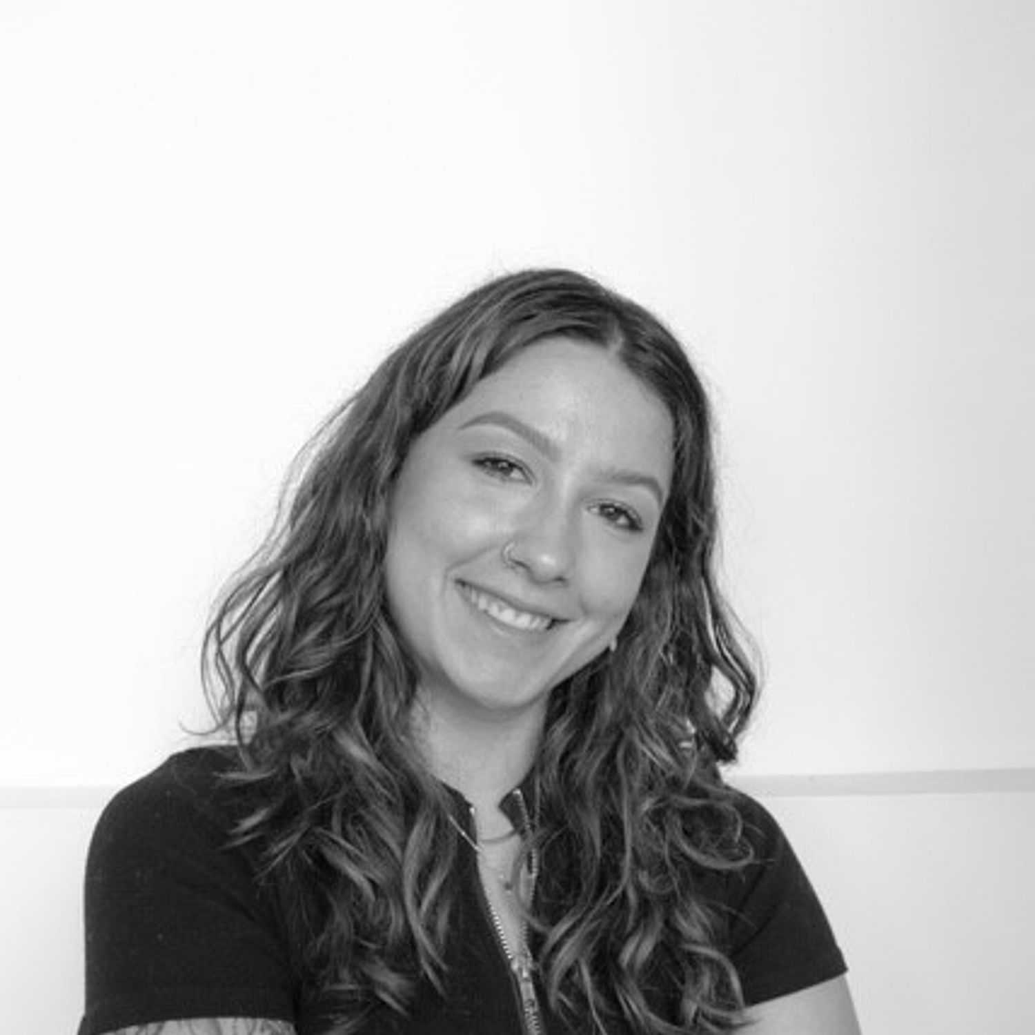 Portrait of Jessica, a professional stylist at CONFETTI CROWN. a salon+spa, showcasing their expertise and style.