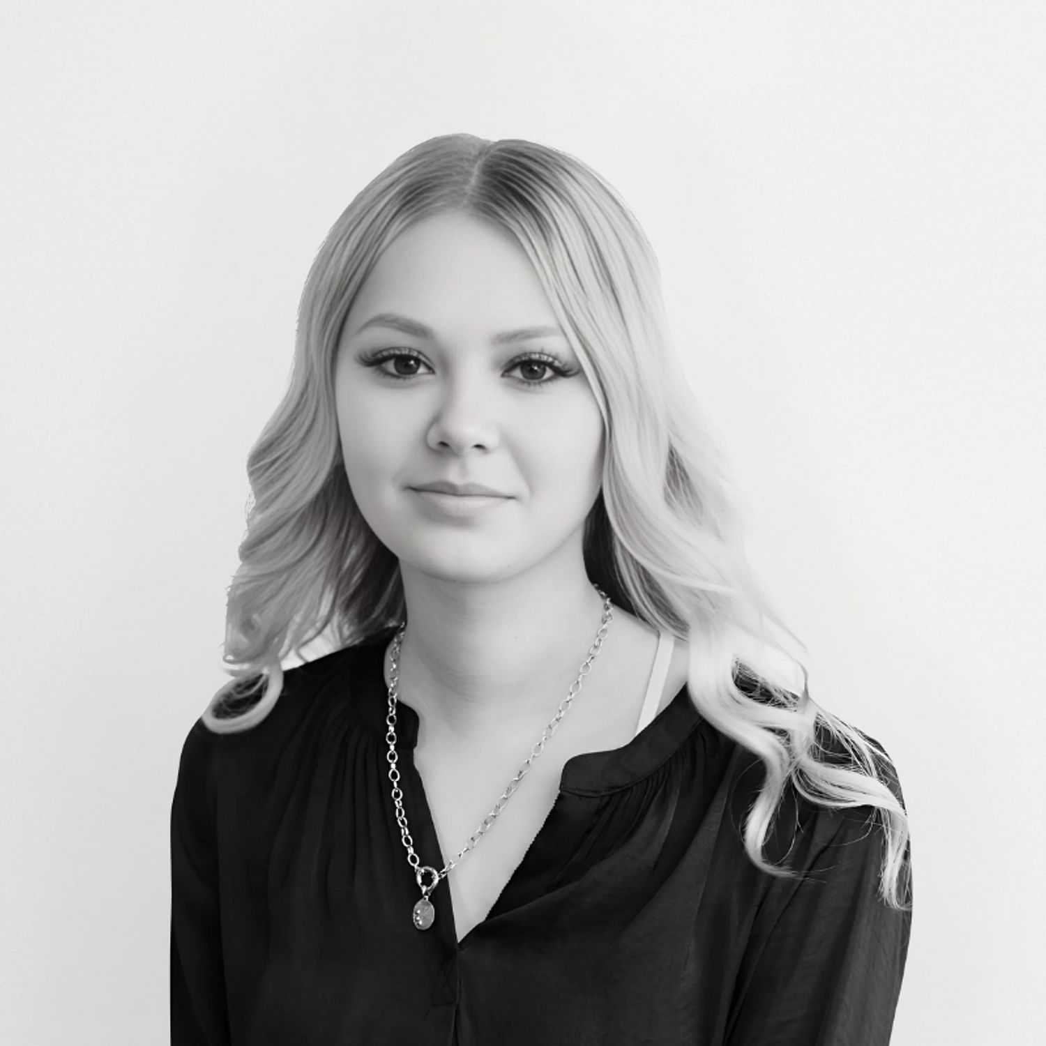 Portrait of Allison, a professional stylist at CONFETTI CROWN. a salon+spa, showcasing their expertise and style.