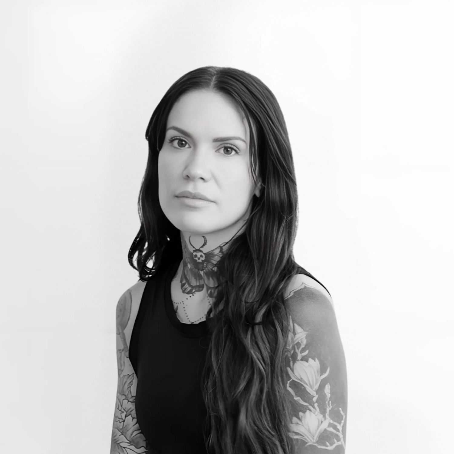 Portrait of Jules, a professional stylist at CONFETTI CROWN. a salon+spa, showcasing their expertise and style.