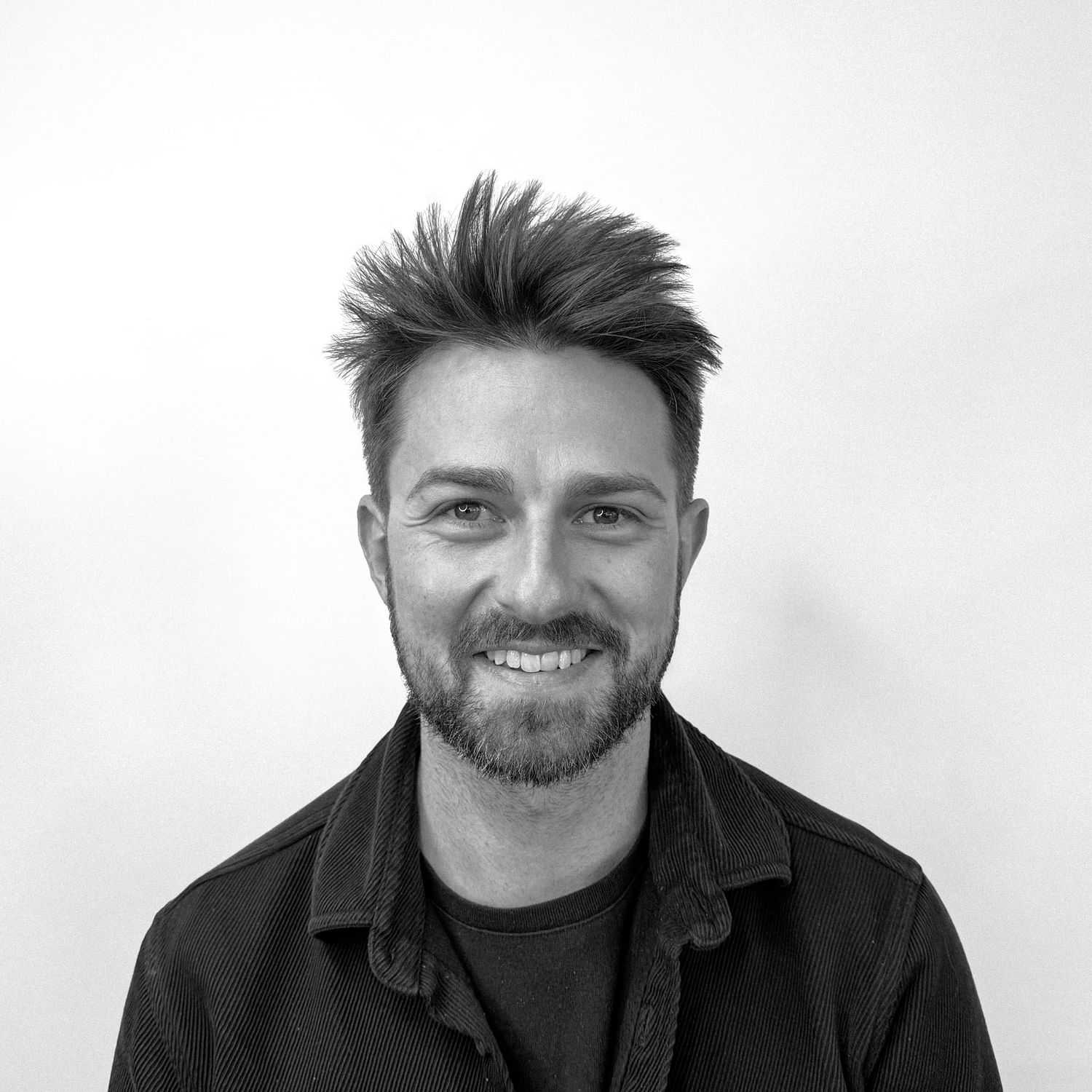 Portrait of Sam, a professional stylist at CONFETTI CROWN. a salon+spa, showcasing their expertise and style.