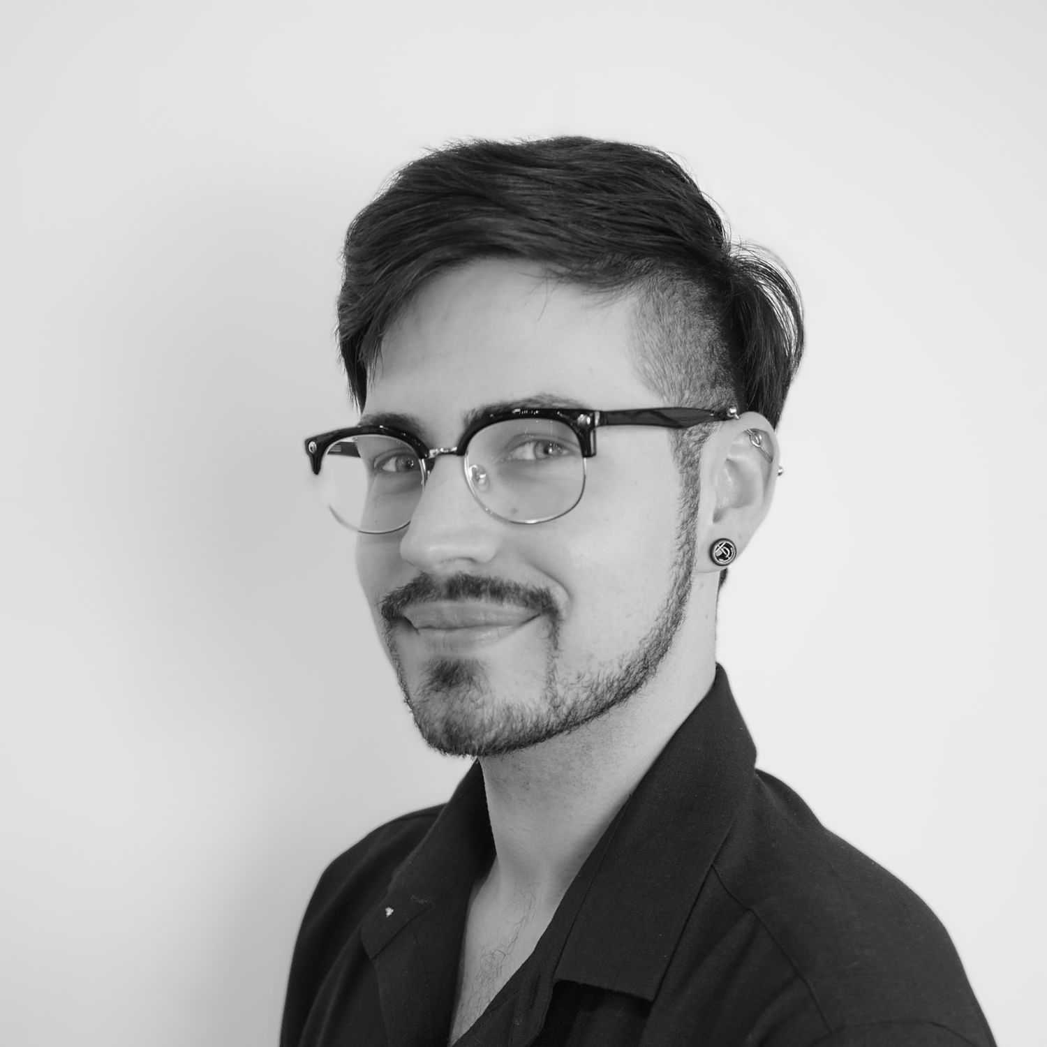 Portrait of Sammy, a professional stylist at CONFETTI CROWN. a salon+spa, showcasing their expertise and style.