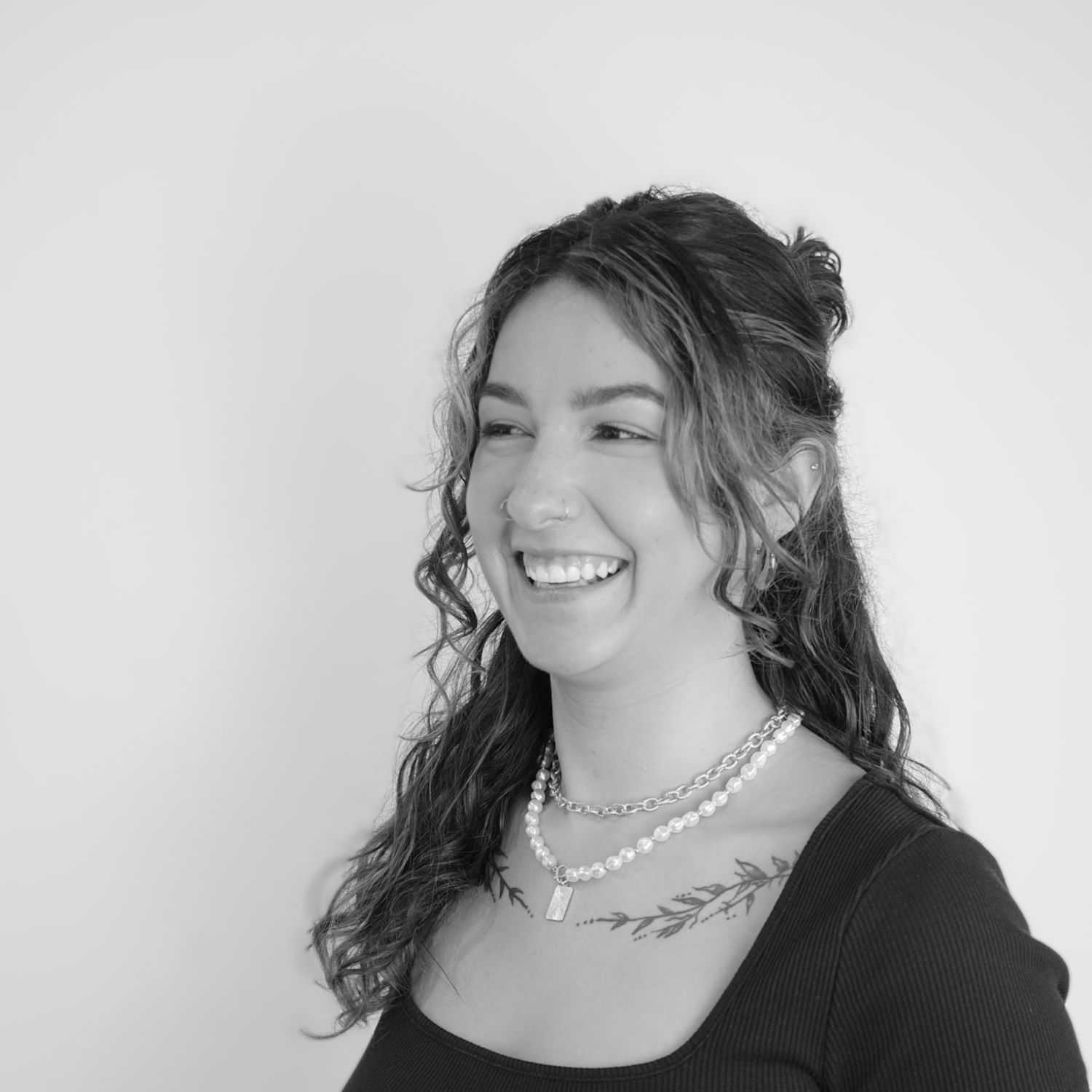 Portrait of Jessica, a professional stylist at CONFETTI CROWN. a salon+spa, showcasing their expertise and style.