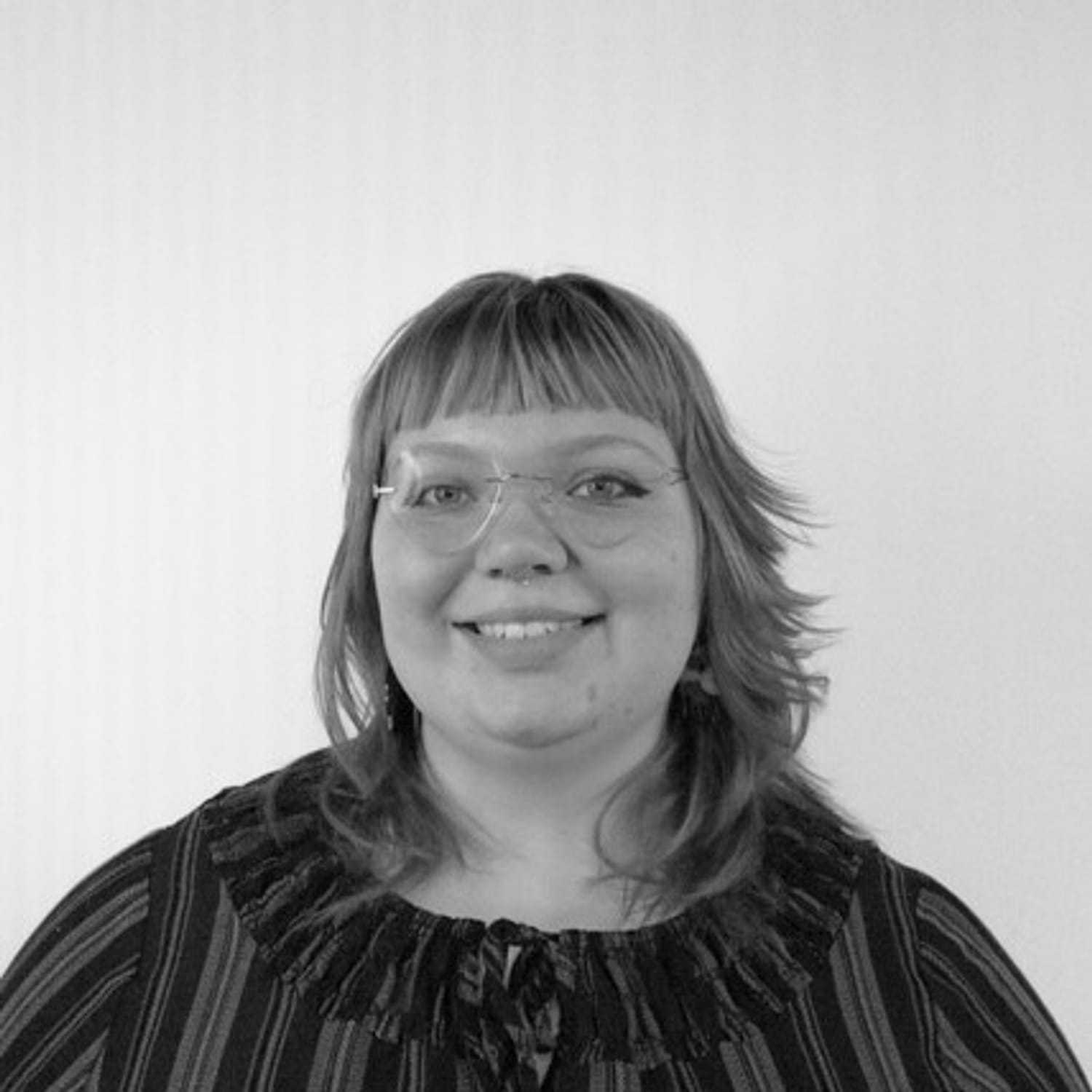 Portrait of Amelia, a professional stylist at CONFETTI CROWN. a salon+spa, showcasing their expertise and style.