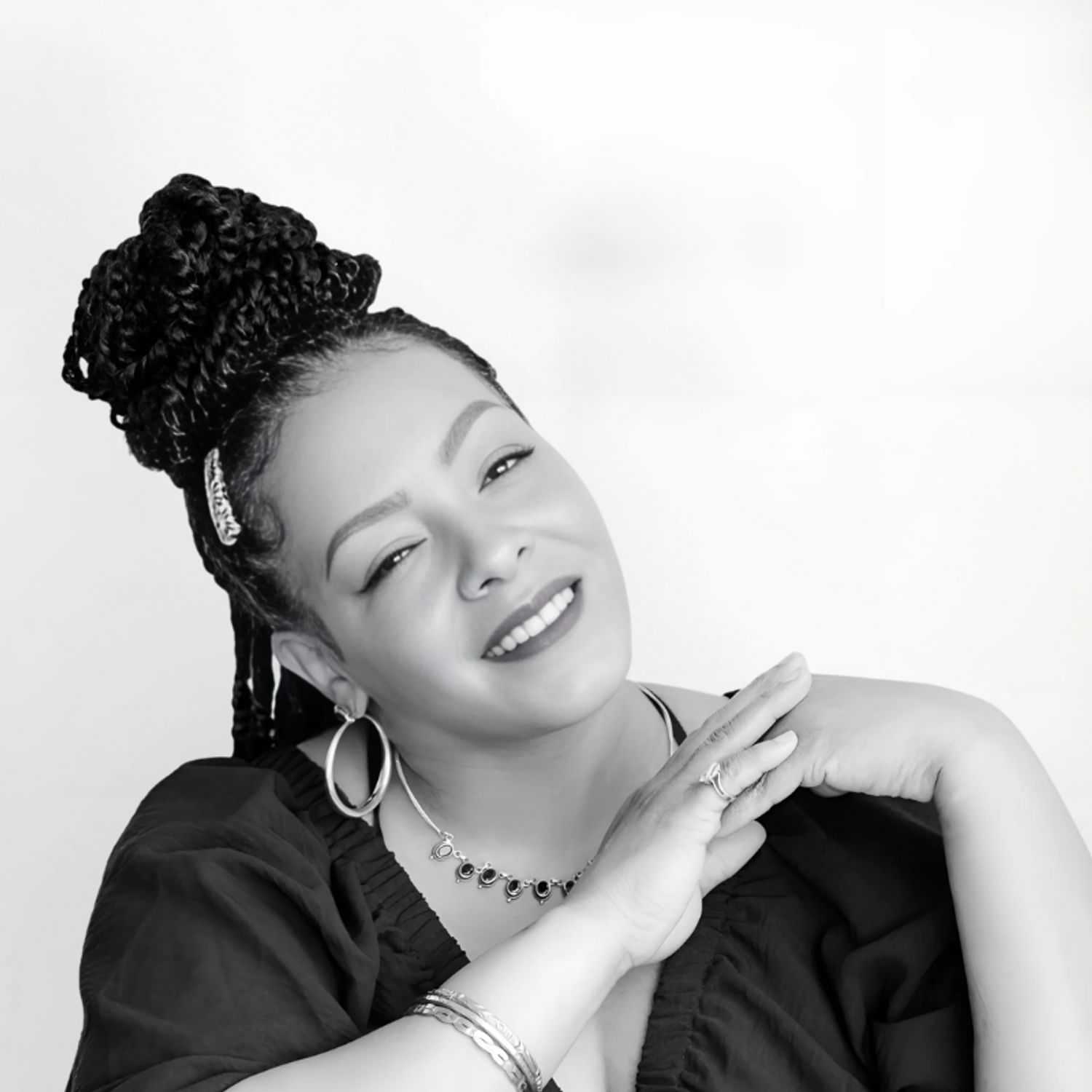 Portrait of Semone, a professional stylist at CONFETTI CROWN. a salon+spa, showcasing their expertise and style.