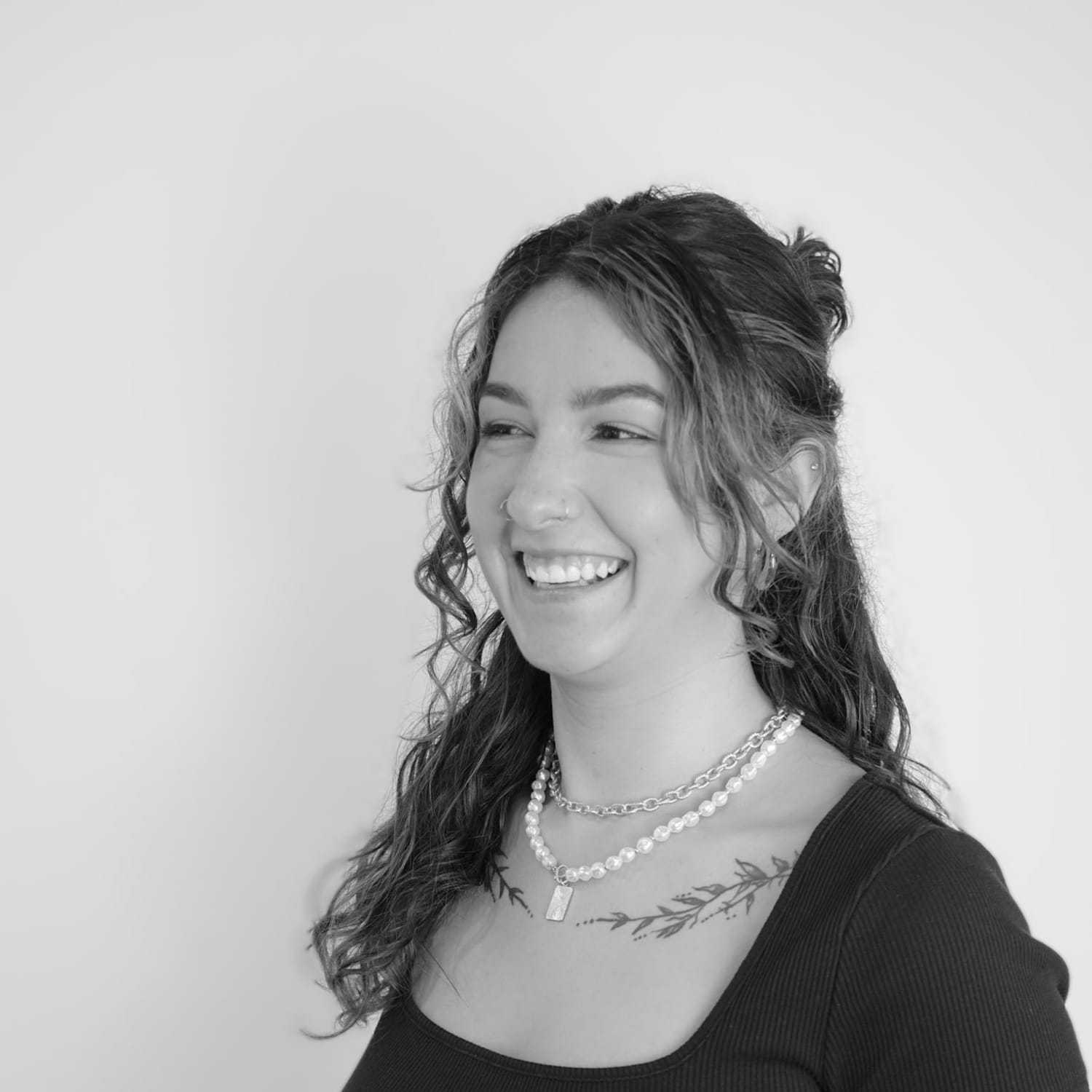 Portrait of Jessica, a professional stylist at CONFETTI CROWN. a salon+spa, showcasing their expertise and style.