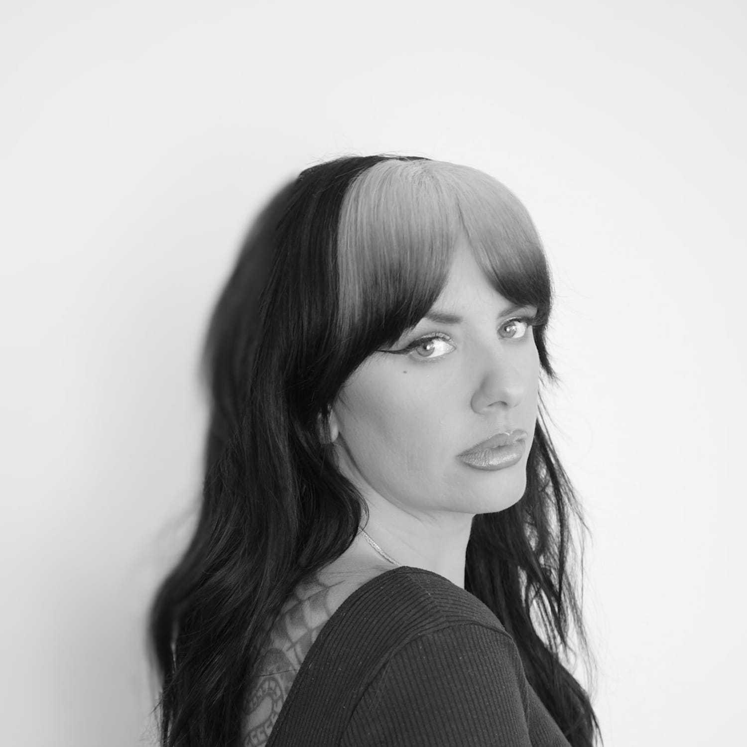 Portrait of Danielle, a professional stylist at CONFETTI CROWN. a salon+spa, showcasing their expertise and style.