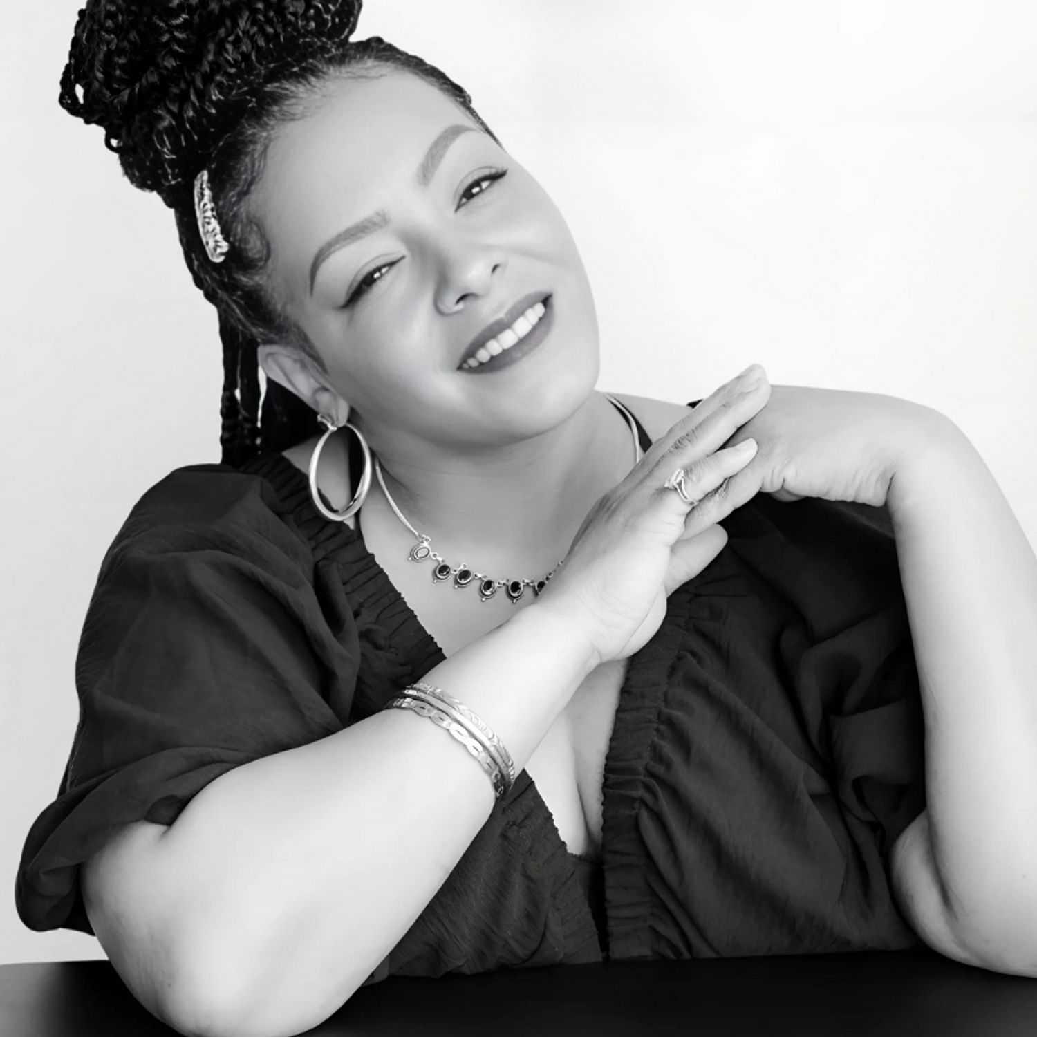 Portrait of Semone, a professional stylist at CONFETTI CROWN. a salon+spa, showcasing their expertise and style.
